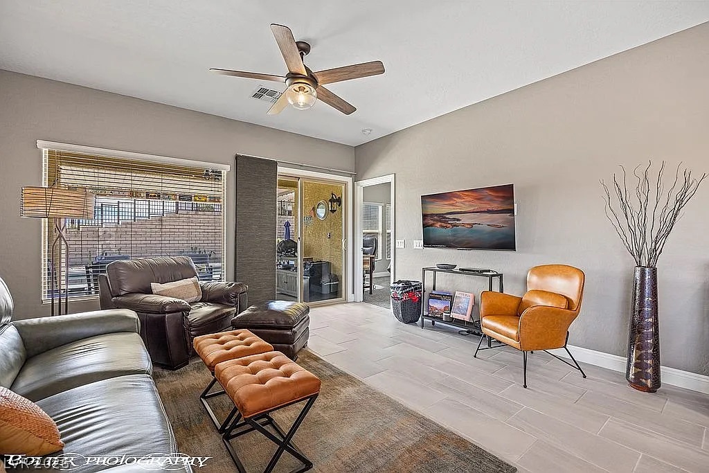 1304 Cottage Ridge Mesquite, NV 89034 - Photo 14 of 52 Relax in this living space, featuring smooth tile flooring and an inviting ceiling fan.