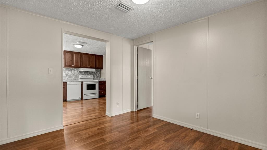 10379 Southwest 135 Street Archer, FL 32618 - Photo 12 of 45 a view of kitchen with microwave and cabinets