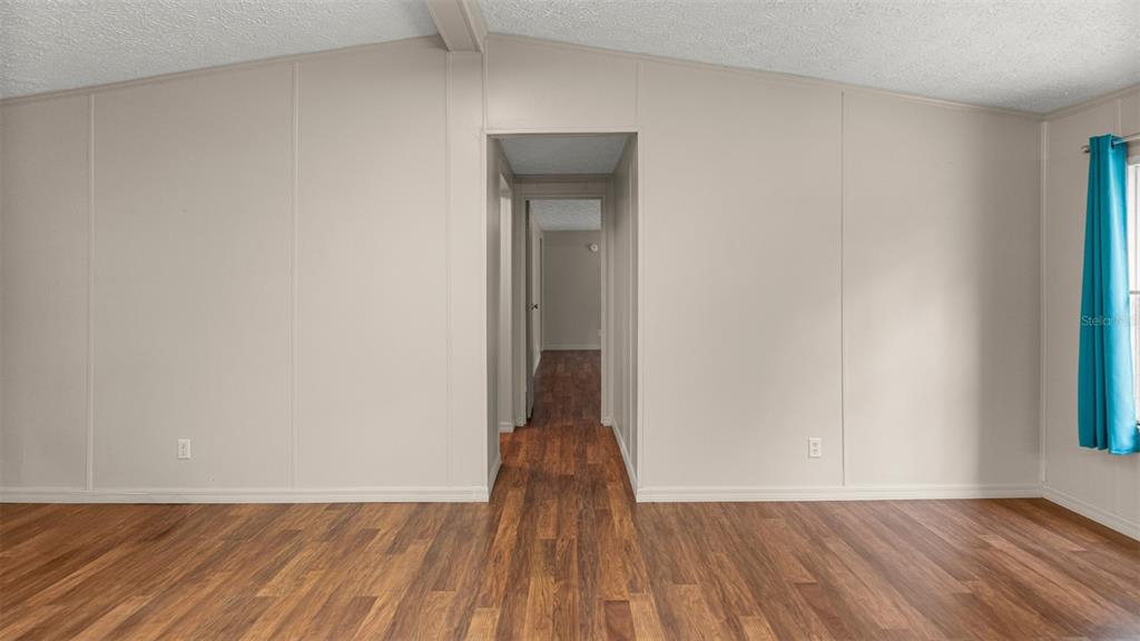 10379 Southwest 135 Street Archer, FL 32618 - Photo 16 of 45 a view of a room with wooden floor and a window
