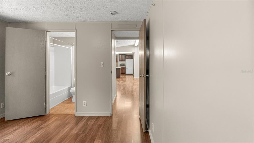 10379 Southwest 135 Street Archer, FL 32618 - Photo 17 of 45 a view of a hallway with wooden floor