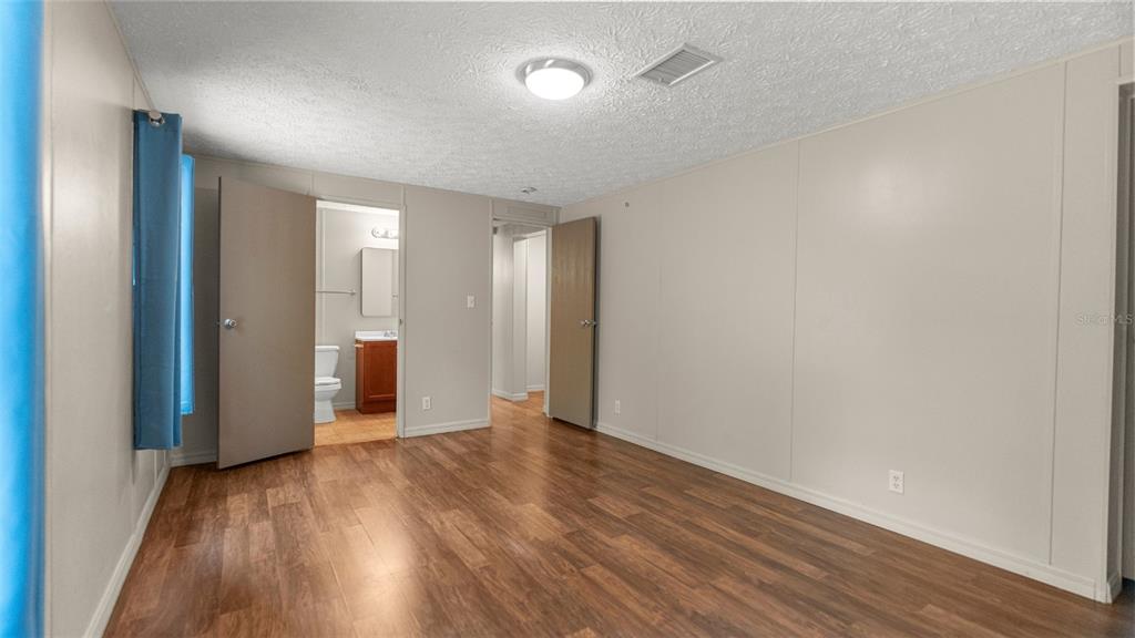 10379 Southwest 135 Street Archer, FL 32618 - Photo 19 of 45 a view of hallway with wooden floor