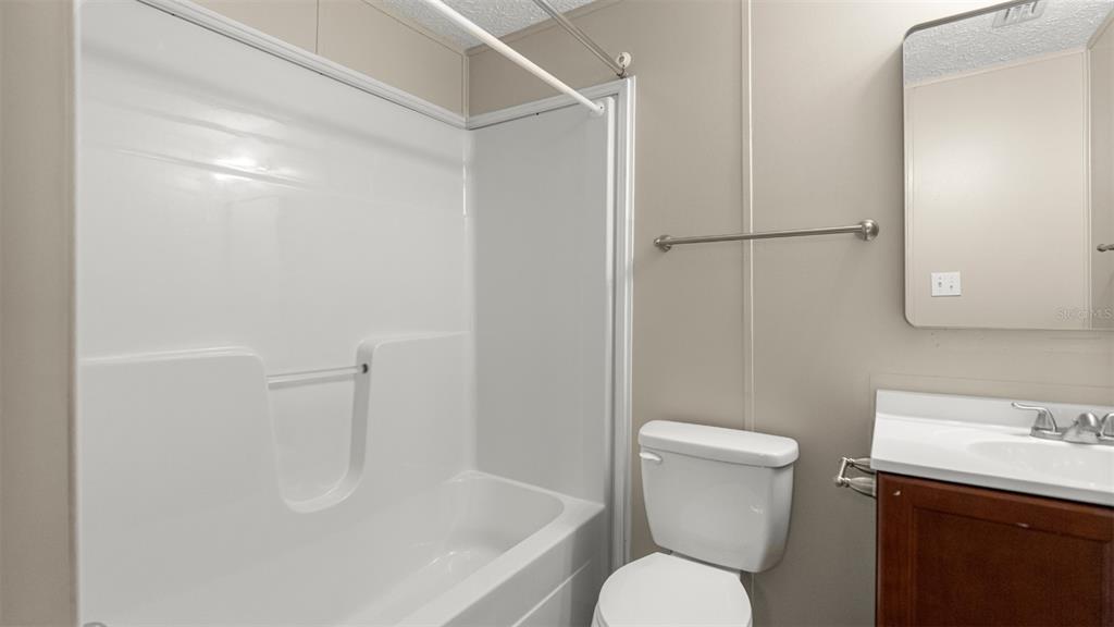 10379 Southwest 135 Street Archer, FL 32618 - Photo 20 of 45 a white toilet sitting next to a bathroom sink