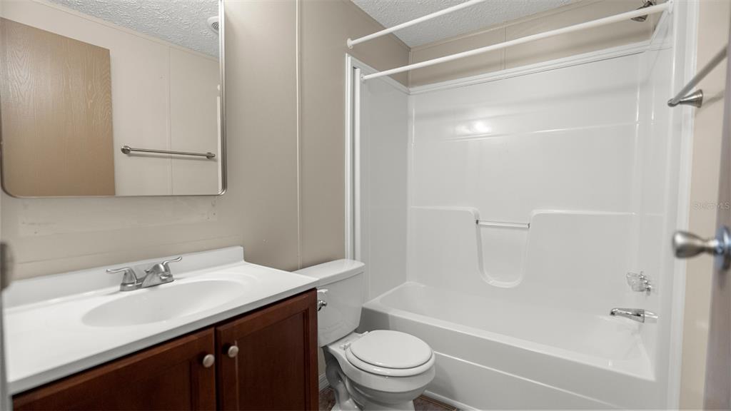 10379 Southwest 135 Street Archer, FL 32618 - Photo 24 of 45 a bathroom with a sink a toilet and shower