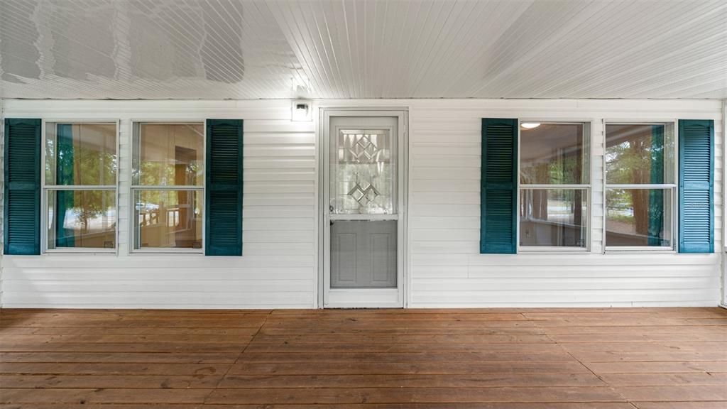 10379 Southwest 135 Street Archer, FL 32618 - Photo 3 of 45 a view of backyard with wooden floor and a window