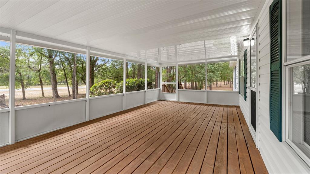 10379 Southwest 135 Street Archer, FL 32618 - Photo 38 of 45 a view of a room with wooden floor and outdoor space