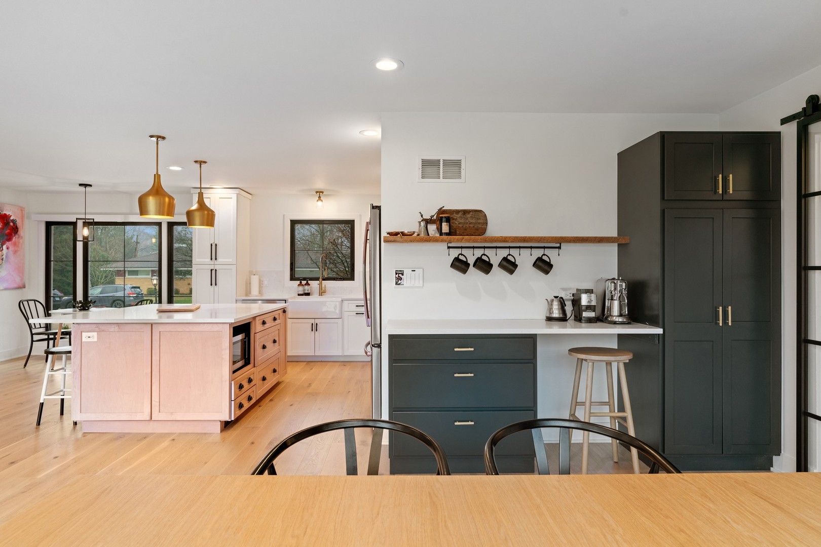 1975 Valley View Road Northfield, IL 60093 - Photo 14 of 40 a kitchen with stainless steel appliances kitchen island granite countertop a refrigerator and a stove top oven