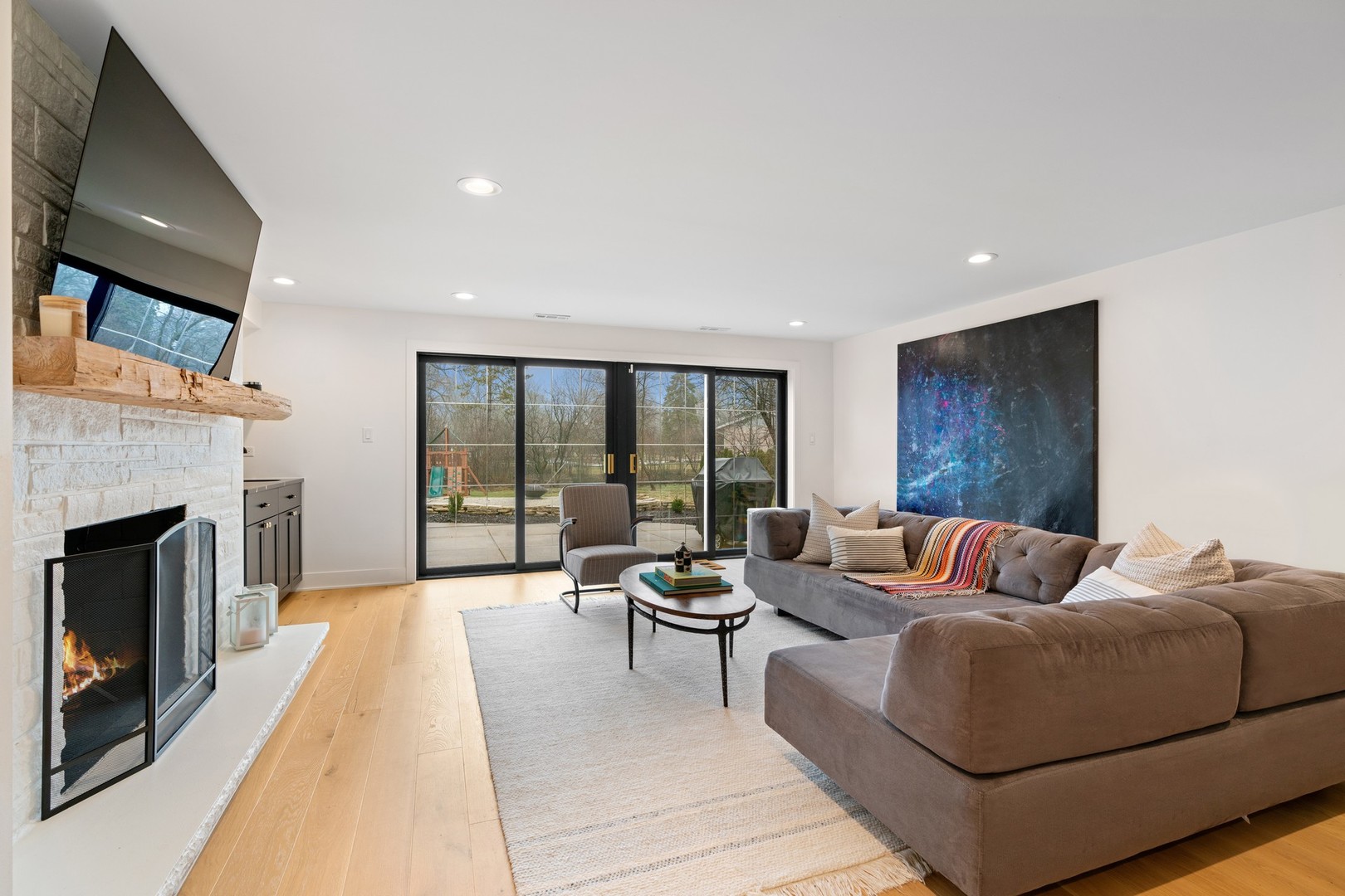 1975 Valley View Road Northfield, IL 60093 - Photo 16 of 40 a living room with furniture and a fireplace