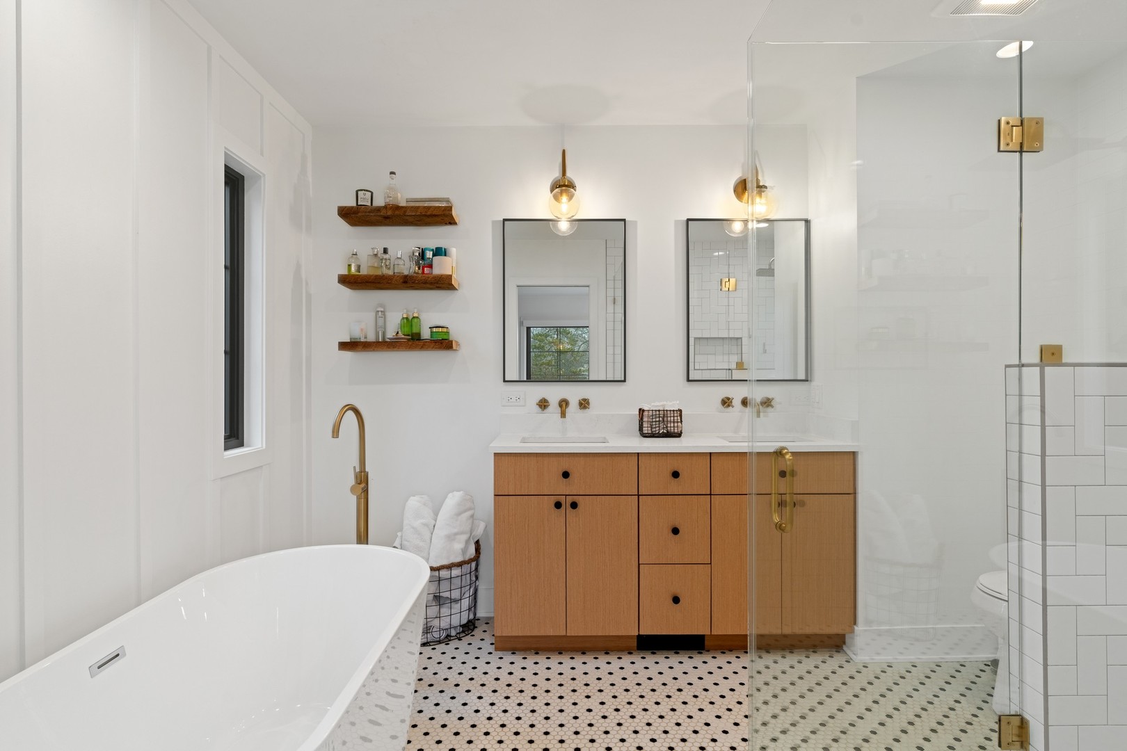 1975 Valley View Road Northfield, IL 60093 - Photo 22 of 40 a spacious bathroom with a bathtub sink vanity mirror and toilet