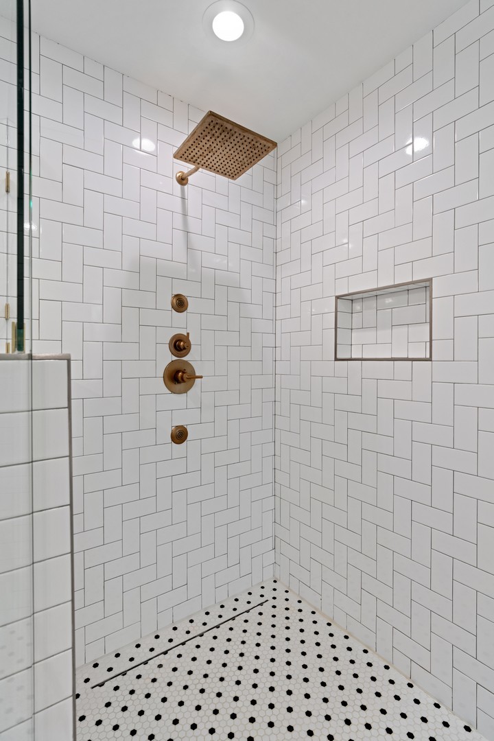 1975 Valley View Road Northfield, IL 60093 - Photo 25 of 40 a bathroom with a shower