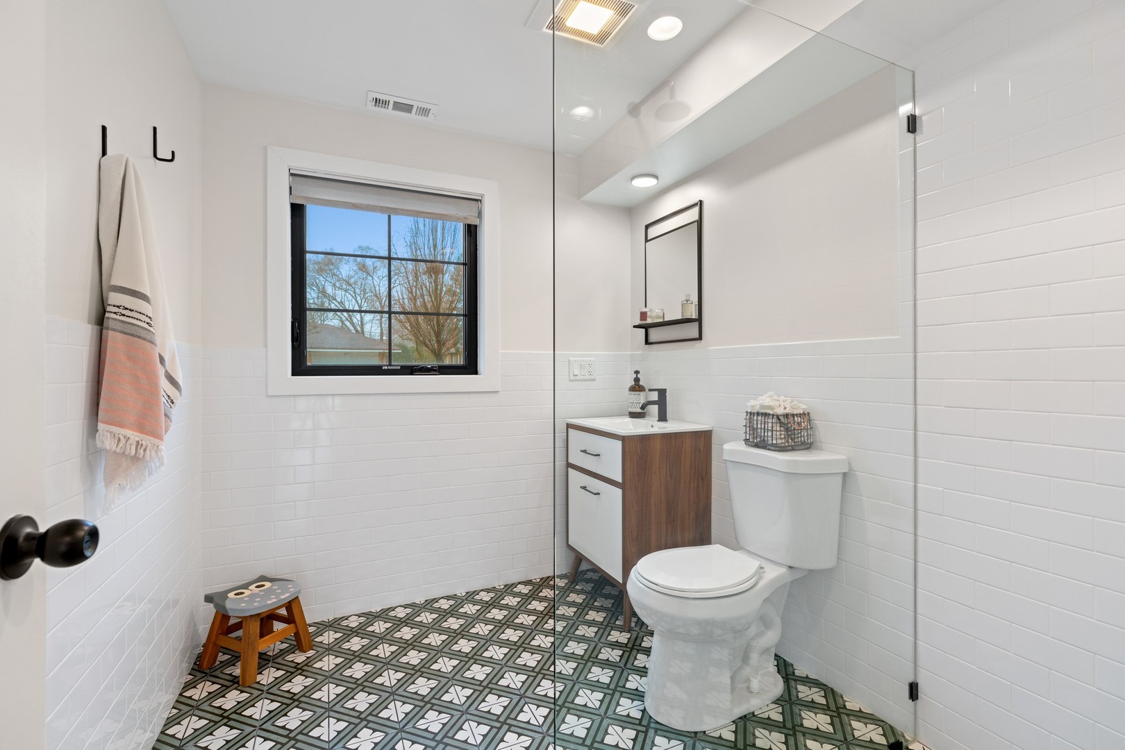 1975 Valley View Road Northfield, IL 60093 - Photo 30 of 40 a bathroom with a toilet a sink and mirror
