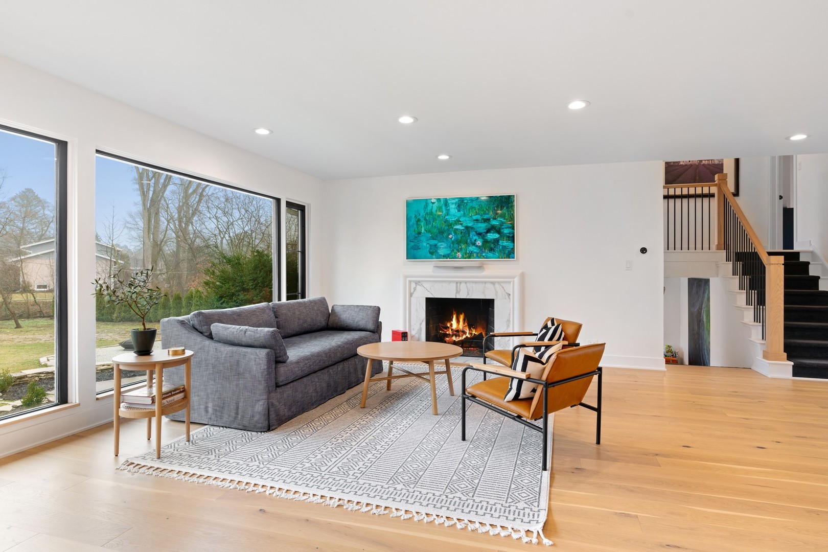 1975 Valley View Road Northfield, IL 60093 - Photo 4 of 40 a living room with furniture a fireplace and a floor to ceiling window