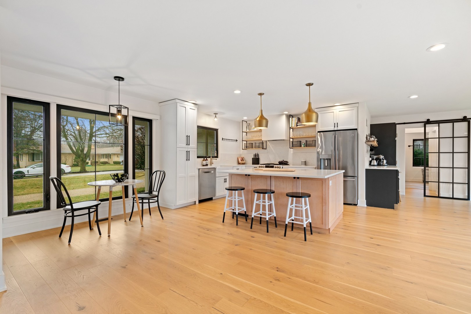 1975 Valley View Road Northfield, IL 60093 - Photo 6 of 40 a dining room with furniture and a kitchen view