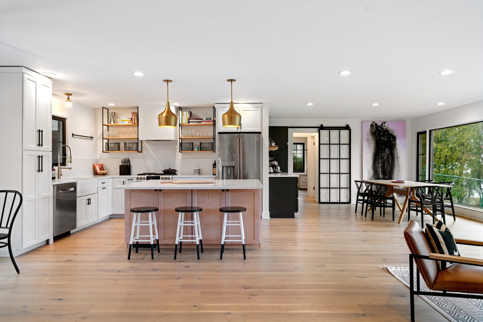 1975 Valley View Road Northfield, IL 60093 - Photo 8 of 40 a open kitchen with stainless steel appliances granite countertop a dining table chairs stove and refrigerator