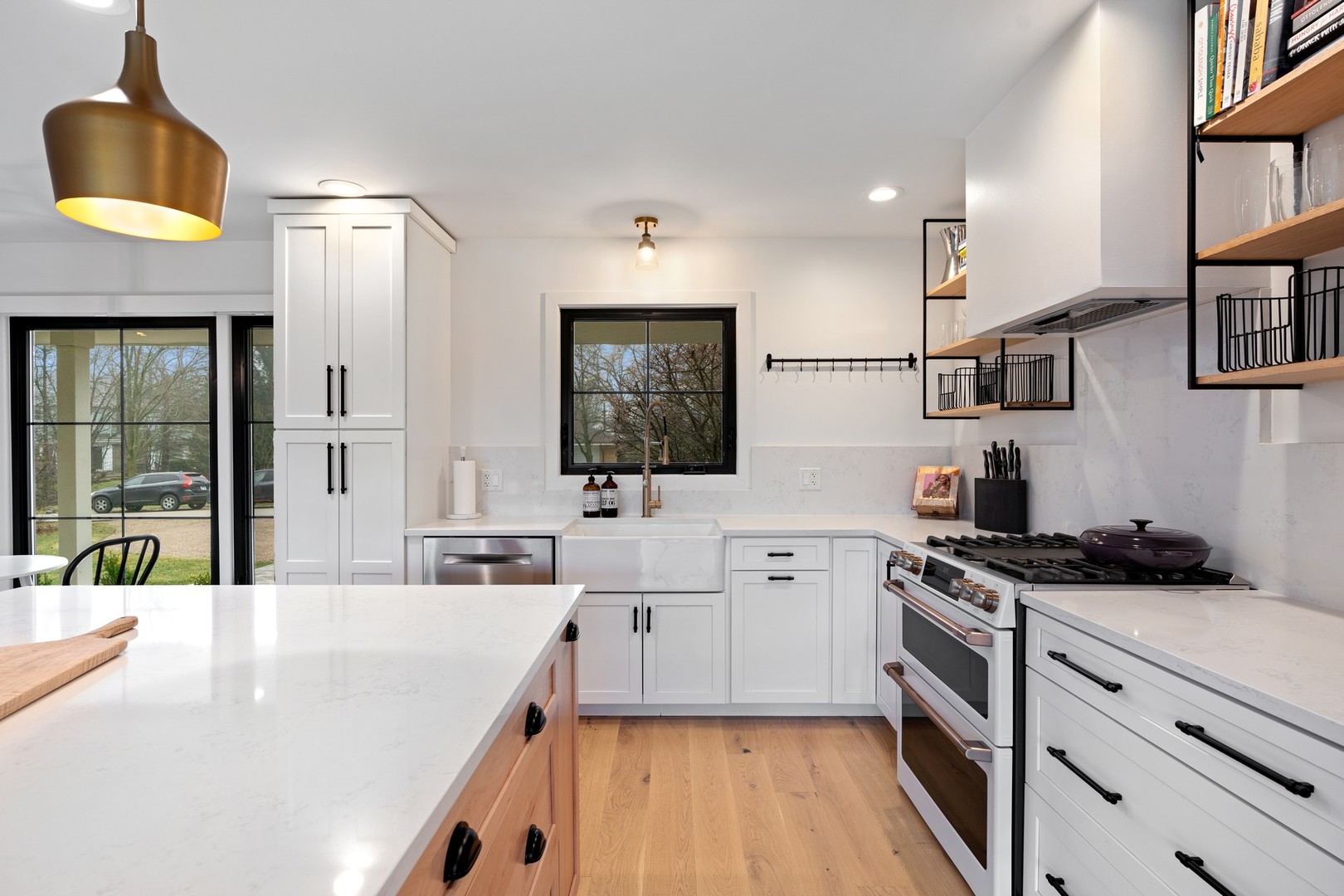 1975 Valley View Road Northfield, IL 60093 - Photo 10 of 40 a kitchen with stainless steel appliances granite countertop a stove a sink and a refrigerator