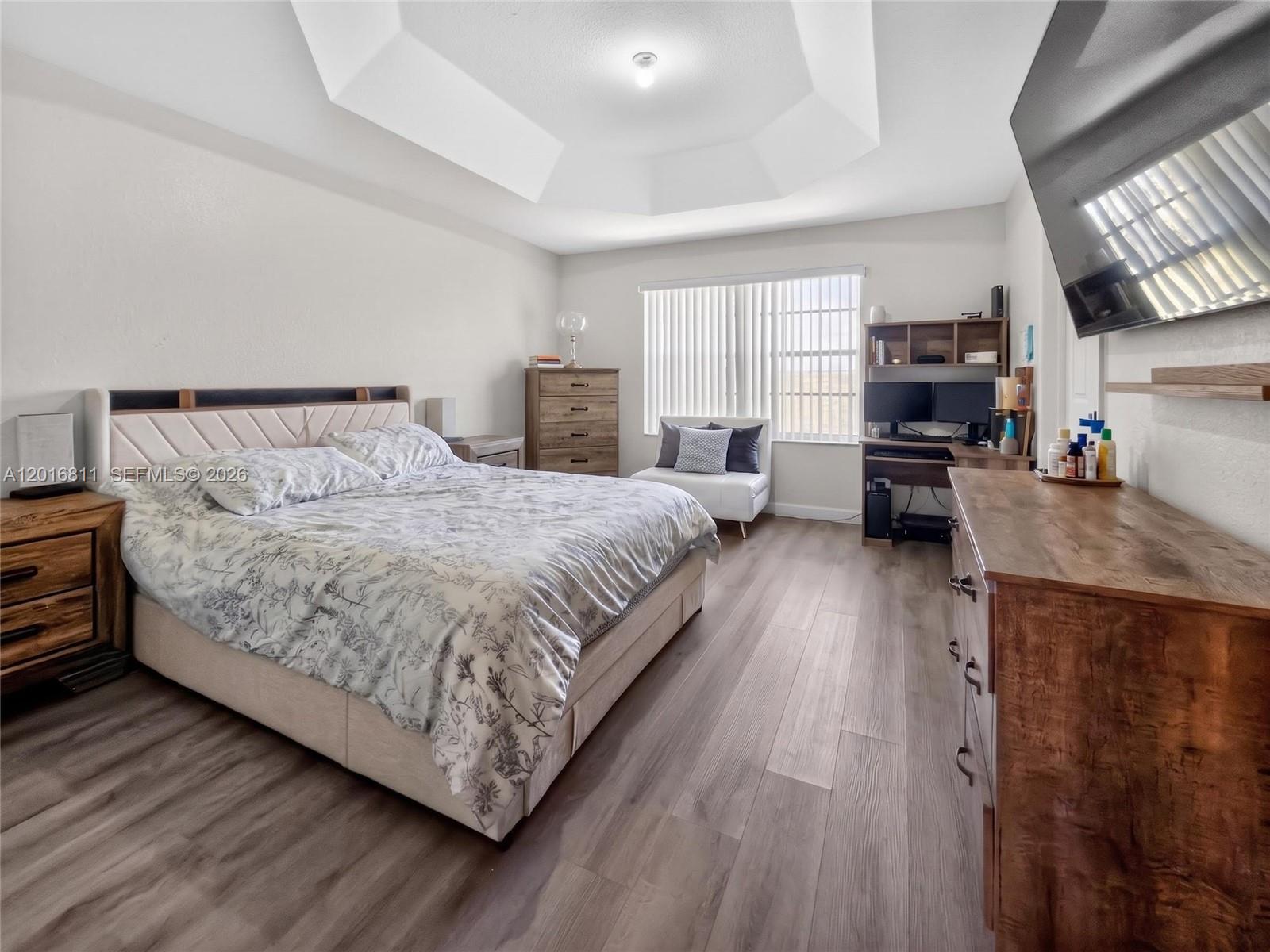 12415 Southwest 42nd Street Miramar, FL 33027 - Photo 15 of 21 a bed room with a bed and a couch