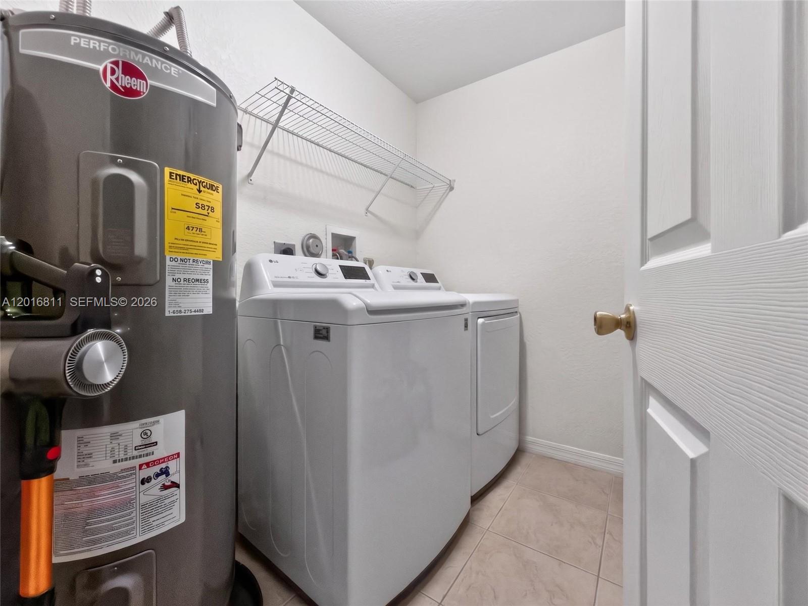 12415 Southwest 42nd Street Miramar, FL 33027 - Photo 17 of 21 a utility room with dryer and washer