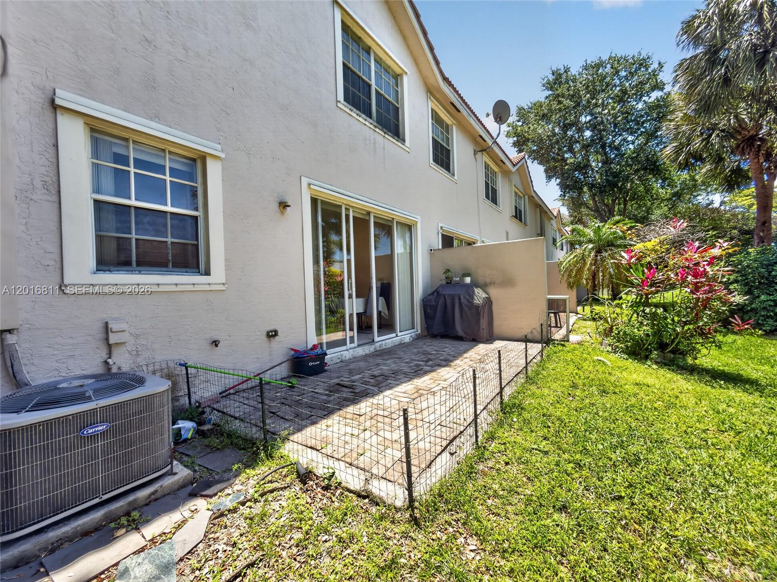 12415 Southwest 42nd Street Miramar, FL 33027 - Photo 18 of 21 a front view of house with yard