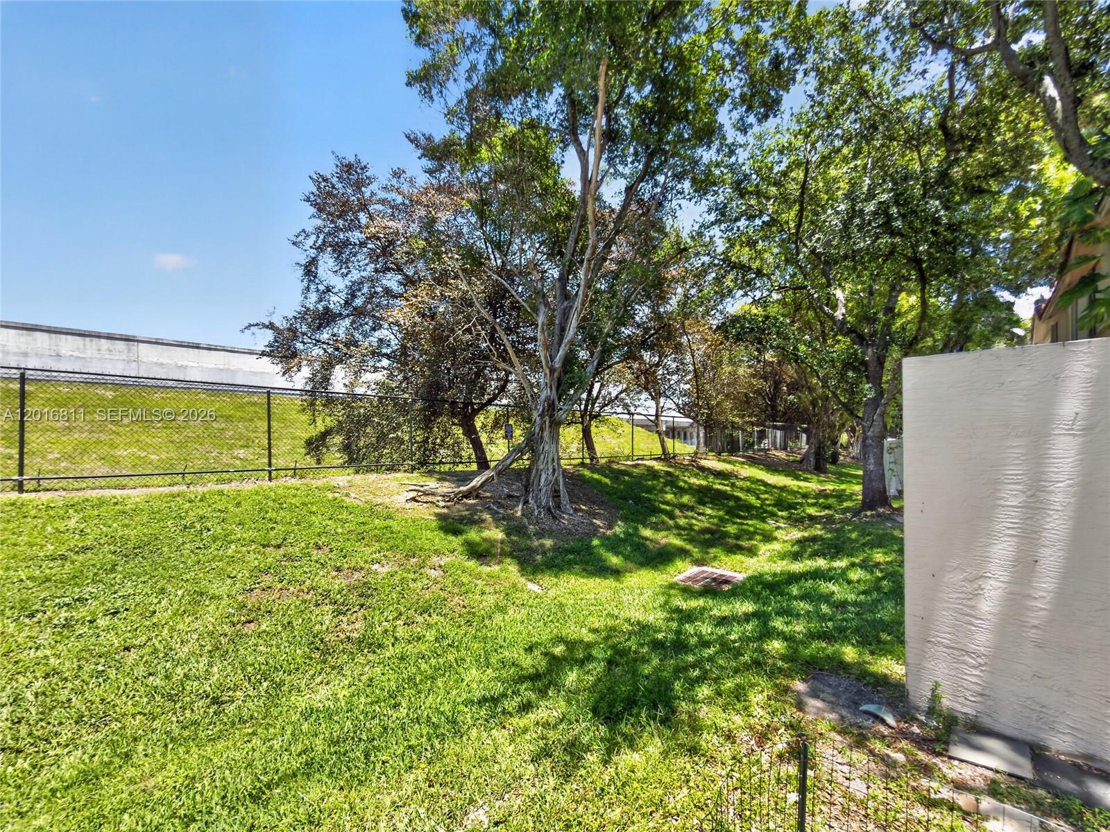 12415 Southwest 42nd Street Miramar, FL 33027 - Photo 20 of 21 a view of a yard with a tree