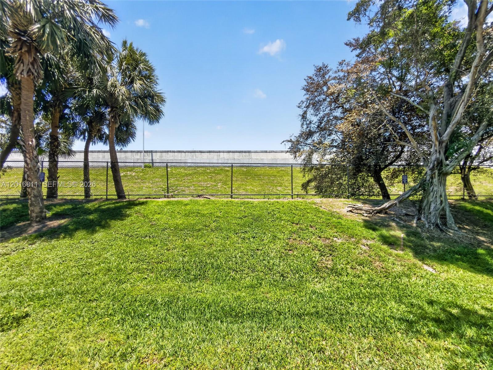 12415 Southwest 42nd Street Miramar, FL 33027 - Photo 21 of 21 a view of yard with swimming pool and trees