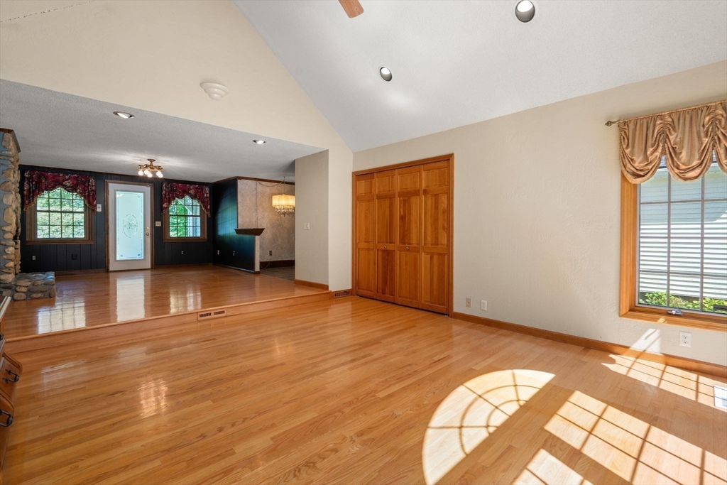 2035 Parker Street Springfield, MA 01128 - Photo 7 of 42 a view of an empty room with window and wooden floor