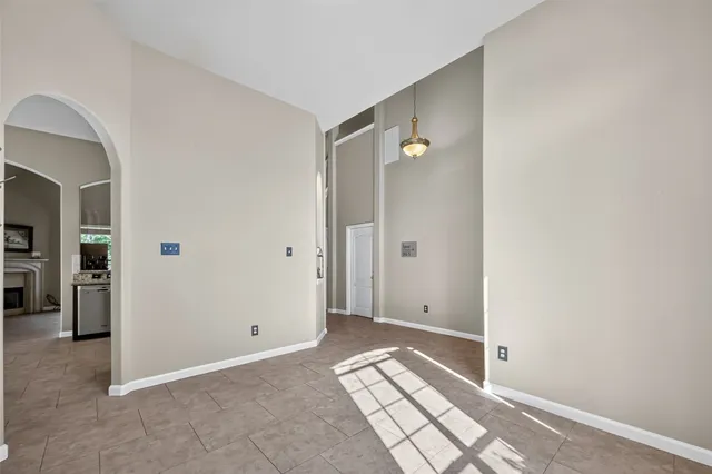 a kitchen with stainless steel appliances granite countertop a refrigerator stove and sink