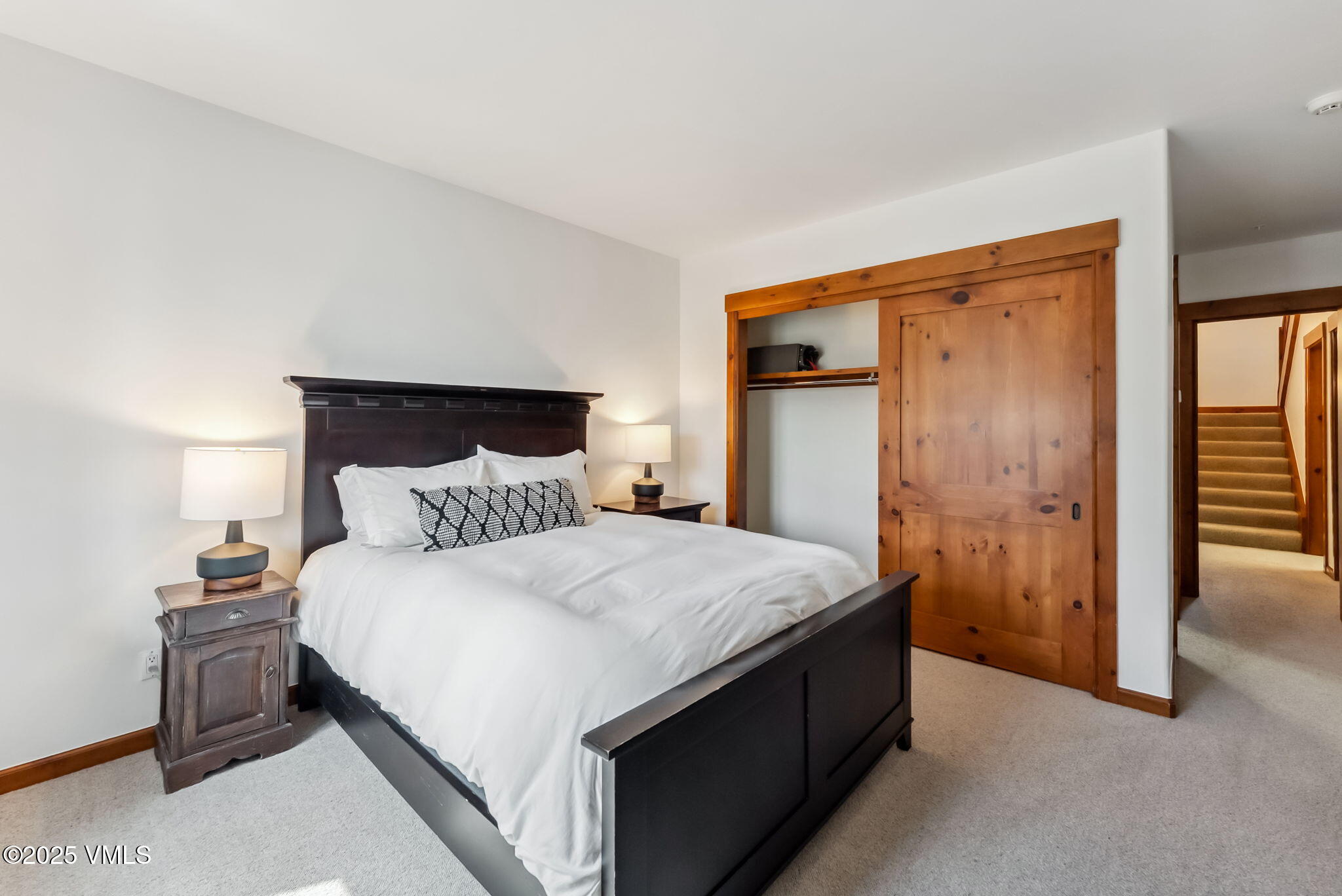 268 Bachelor Ridge Road Avon, CO 81620 - Photo 16 of 25 a bedroom with a bed and a mirror