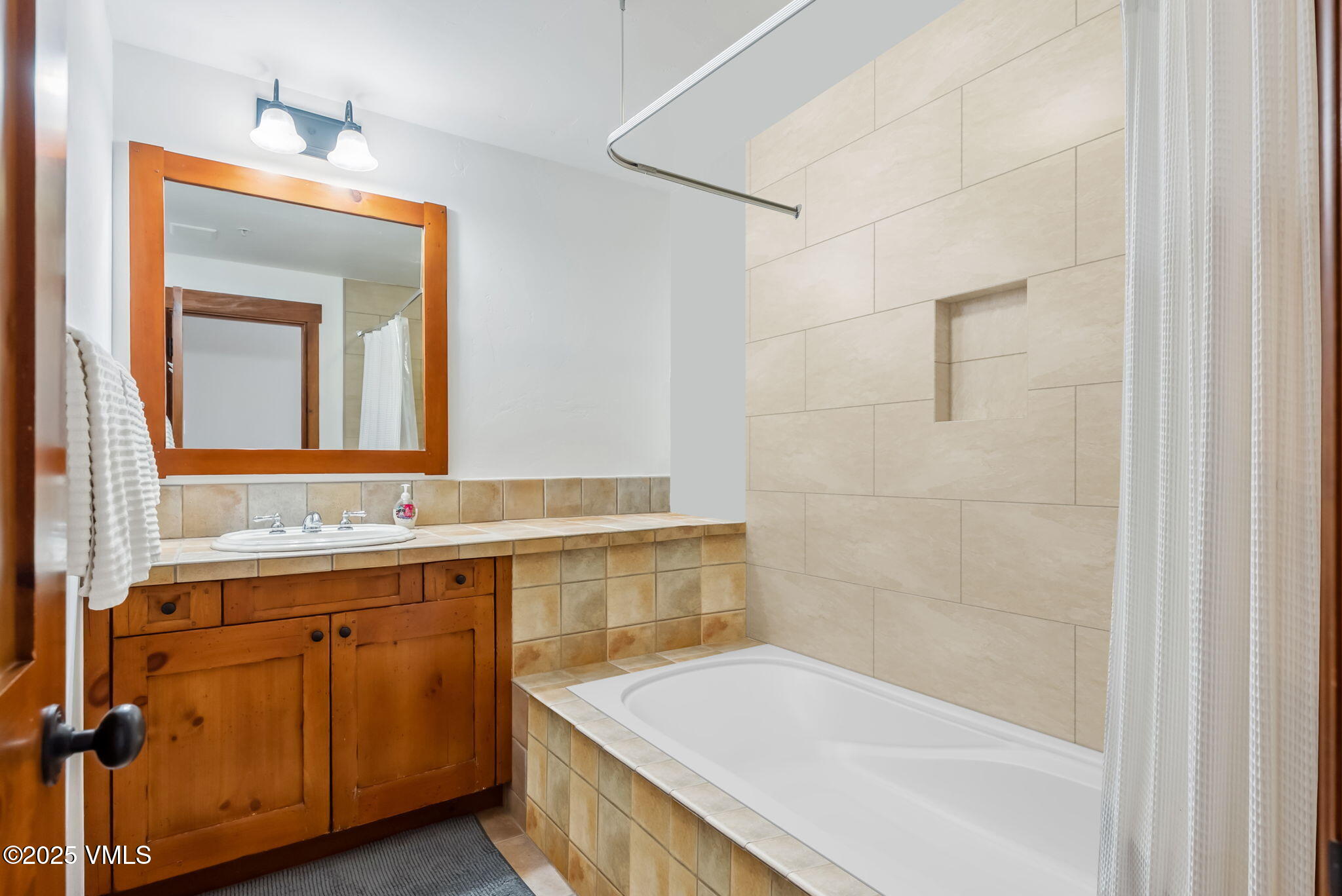 268 Bachelor Ridge Road Avon, CO 81620 - Photo 20 of 25 a bathroom with a tub sink and mirror