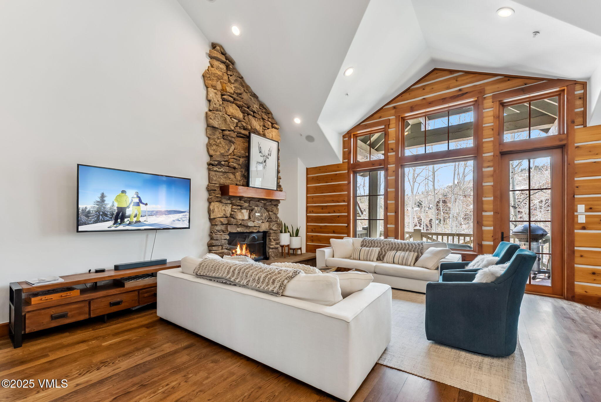 268 Bachelor Ridge Road Avon, CO 81620 - Photo 3 of 25 a living room with furniture fireplace and a large window