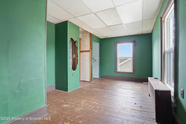 a view of a room with window and stairs
