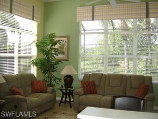 8582 Peppertree Way Naples, FL 34114 - Photo 4 of 8 a living room with furniture and a window