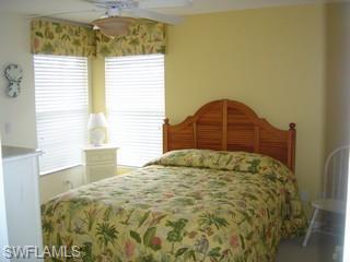 8582 Peppertree Way Naples, FL 34114 - Photo 7 of 8 a bedroom with a bed and a window