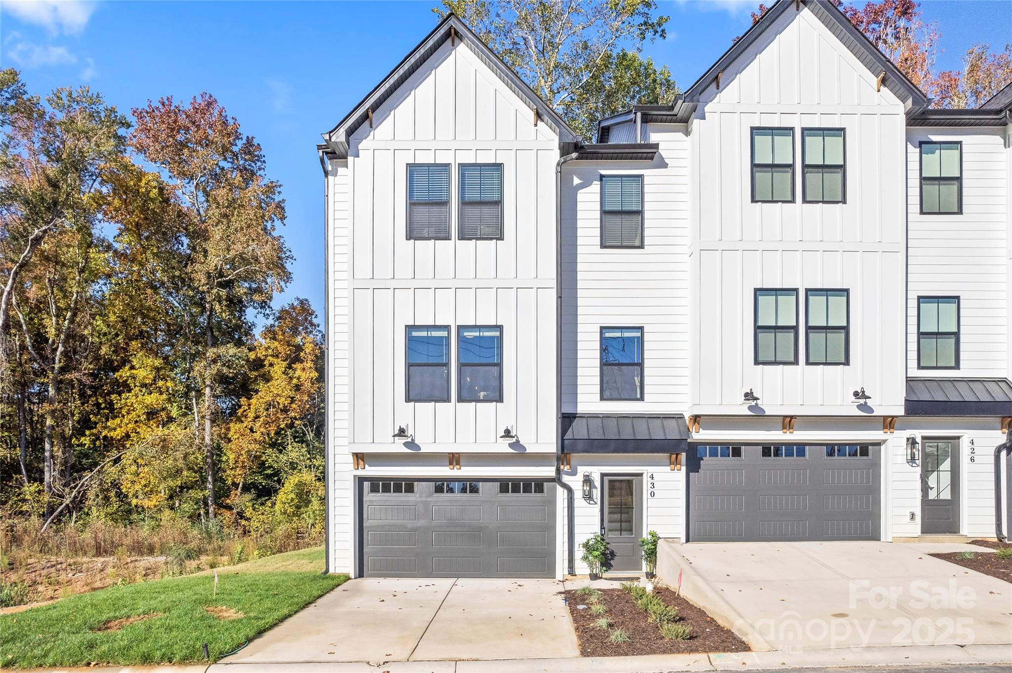 430 Bogue Drive, Unit 24 Fort Mill, SC 29708 - Photo 2 of 48 a front view of a house with a garden