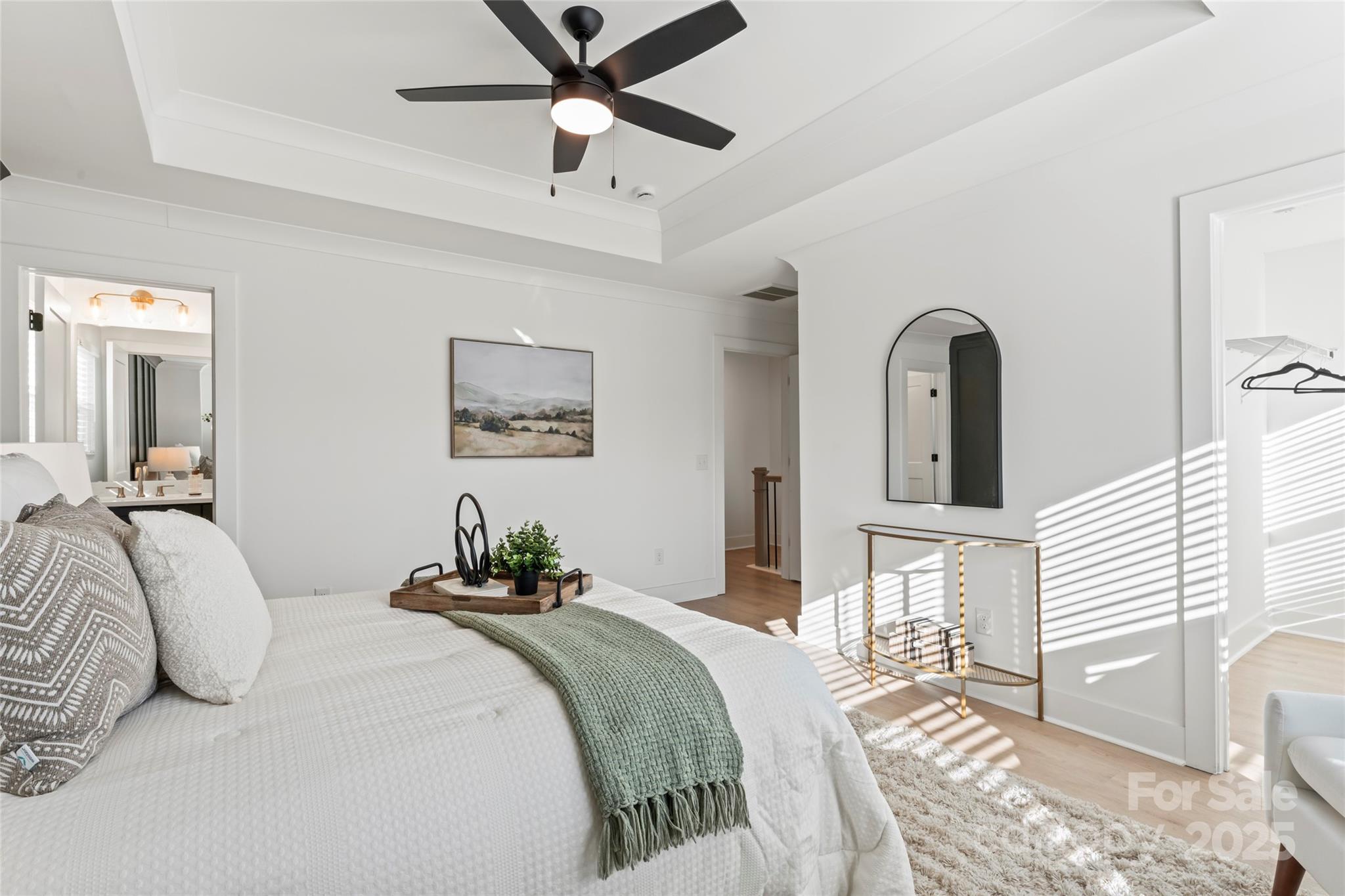 430 Bogue Drive, Unit 24 Fort Mill, SC 29708 - Photo 27 of 48 a bedroom with a bed and a chandelier