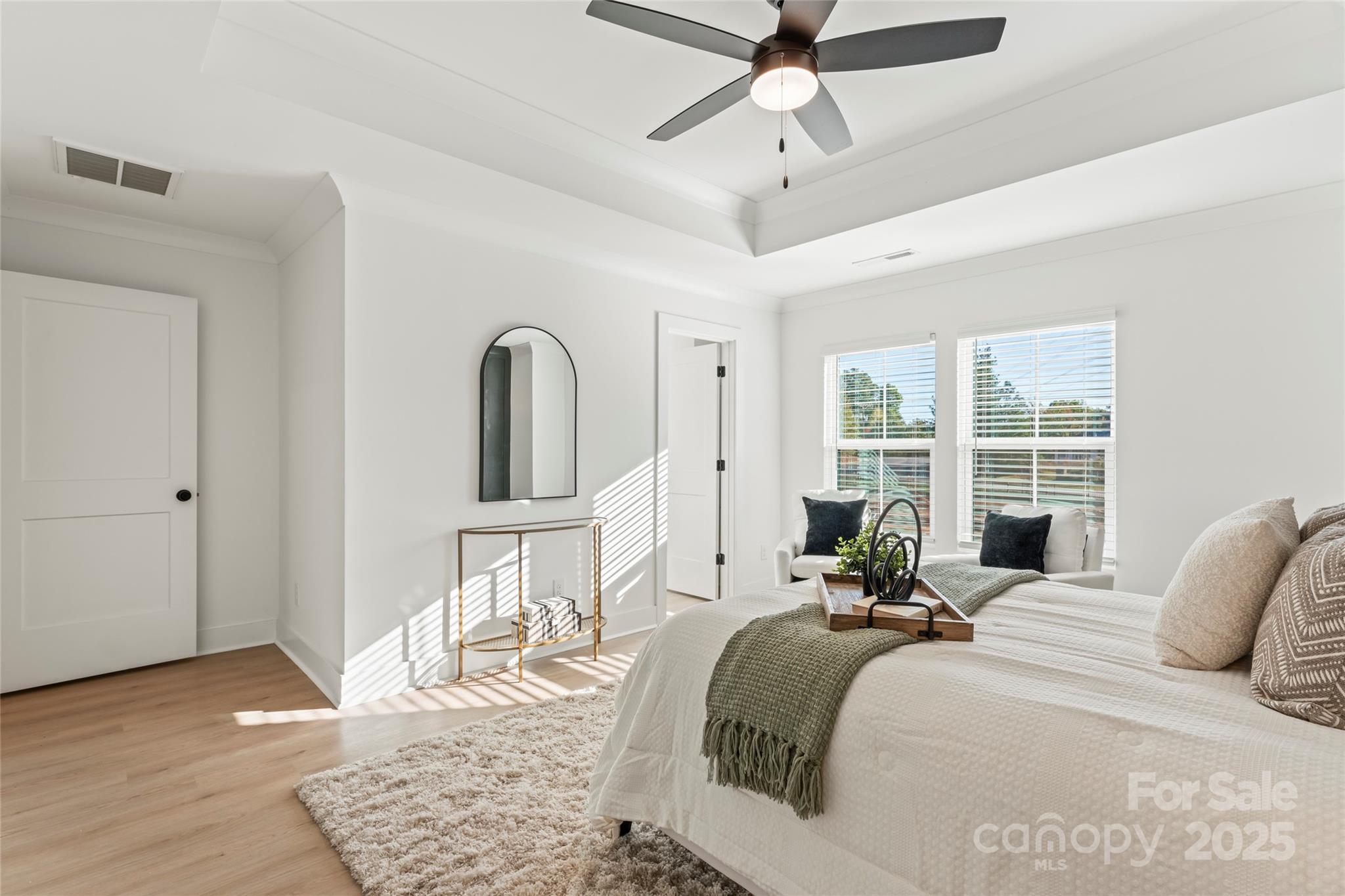 430 Bogue Drive, Unit 24 Fort Mill, SC 29708 - Photo 28 of 48 a bed room with a bed a chandelier and a window