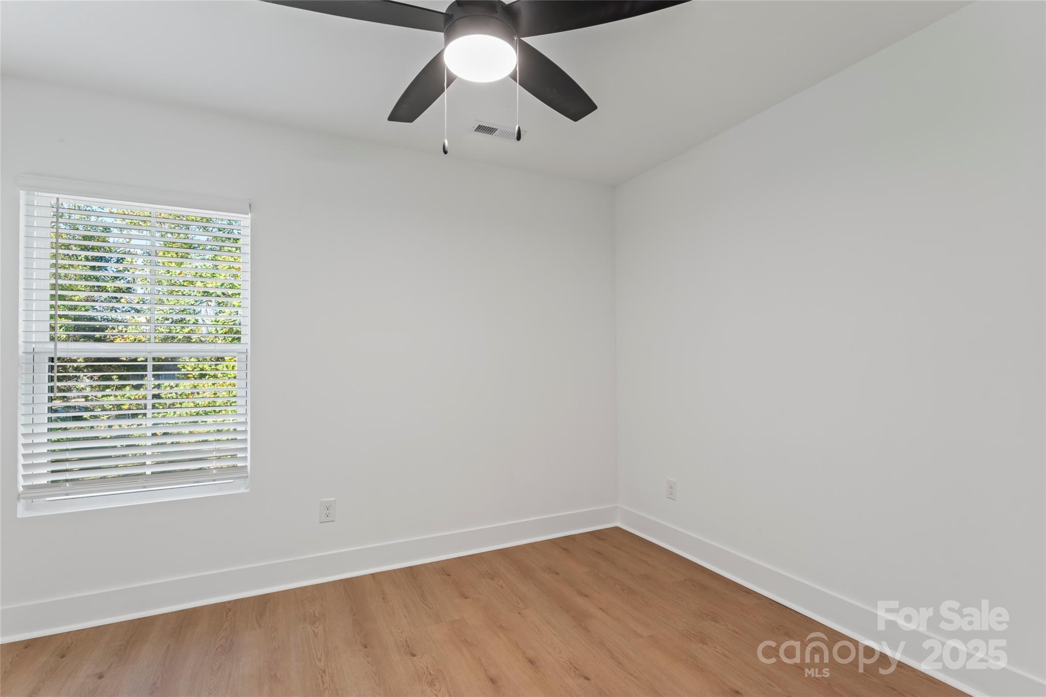 430 Bogue Drive, Unit 24 Fort Mill, SC 29708 - Photo 32 of 48 an empty room with a window and a fan