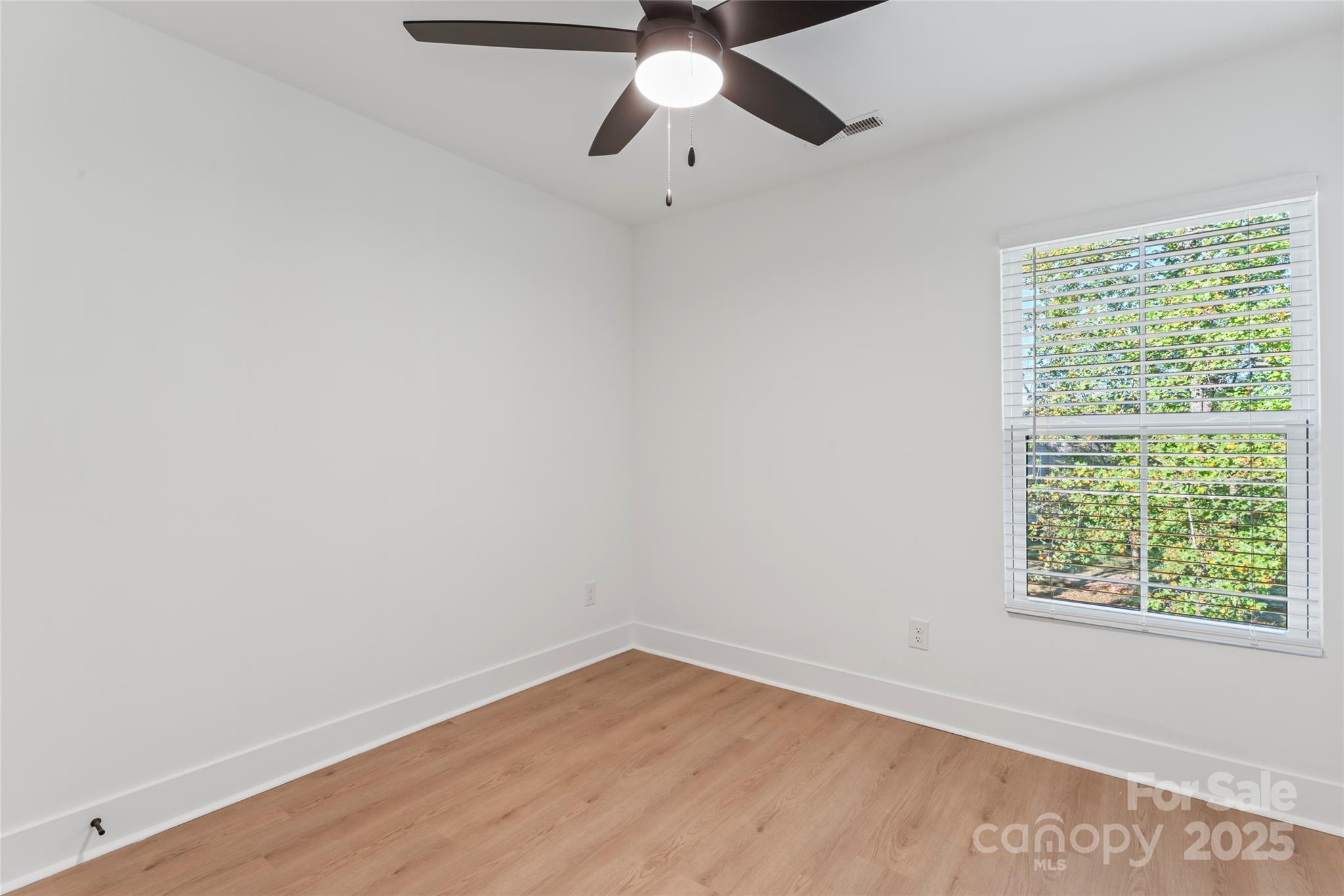 430 Bogue Drive, Unit 24 Fort Mill, SC 29708 - Photo 35 of 48 an empty room with a window and a fan
