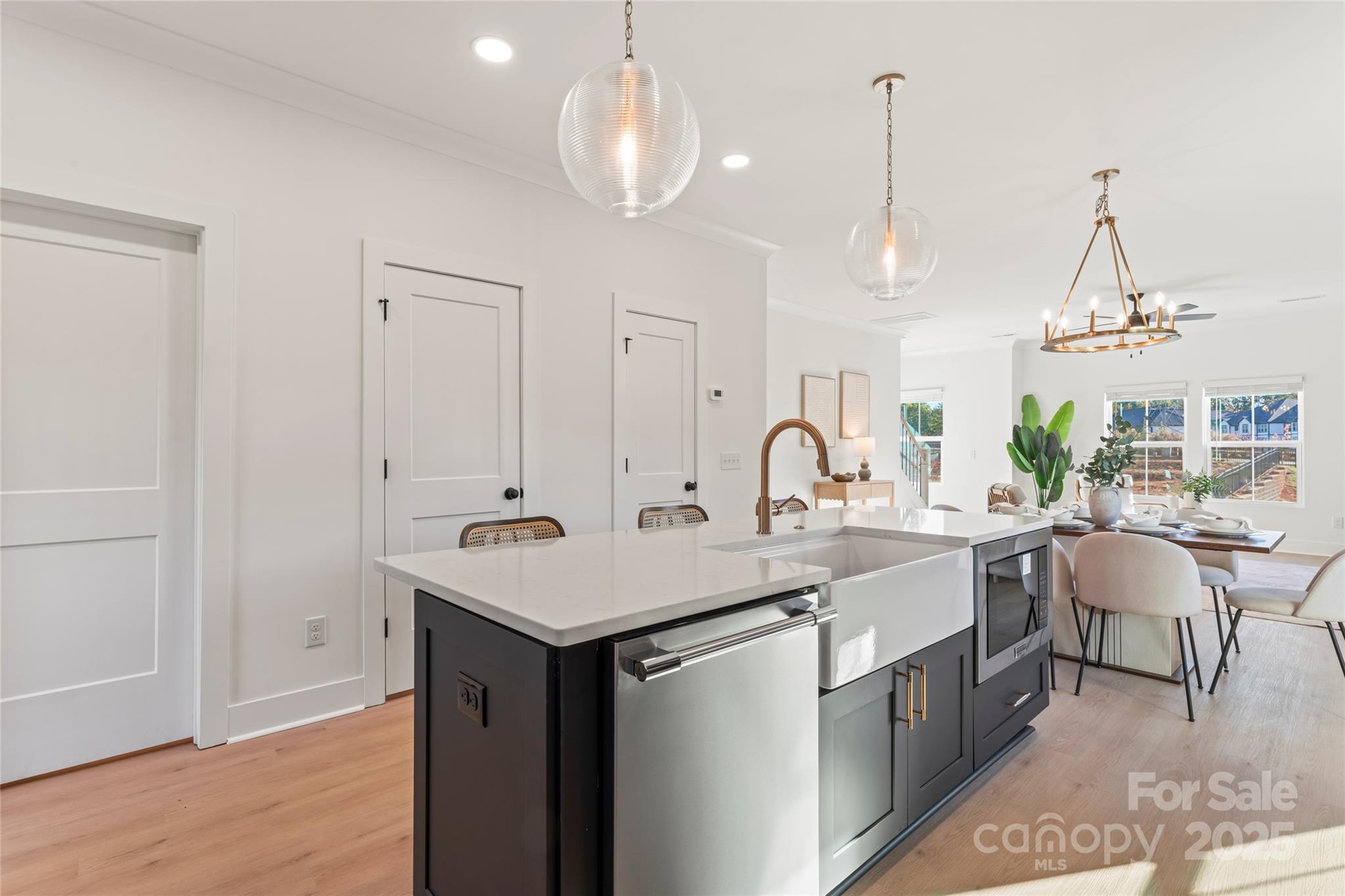 430 Bogue Drive, Unit 24 Fort Mill, SC 29708 - Photo 7 of 48 a kitchen with sink cabinets and dining table