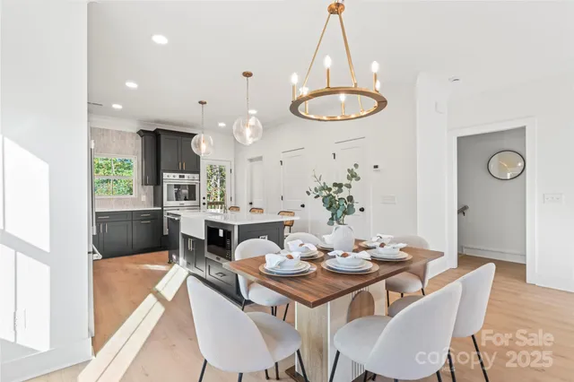 a dining room with granite countertop a table and chairs