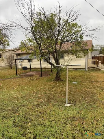 a view of a yard with an trees