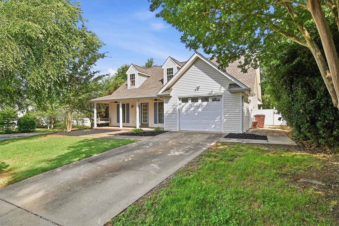 101 Grand Oak Circle Pendleton, SC 29670 - Photo 2 of 40 A classic facade with a charming covered porch and an attached garage offers inviting curb appeal.