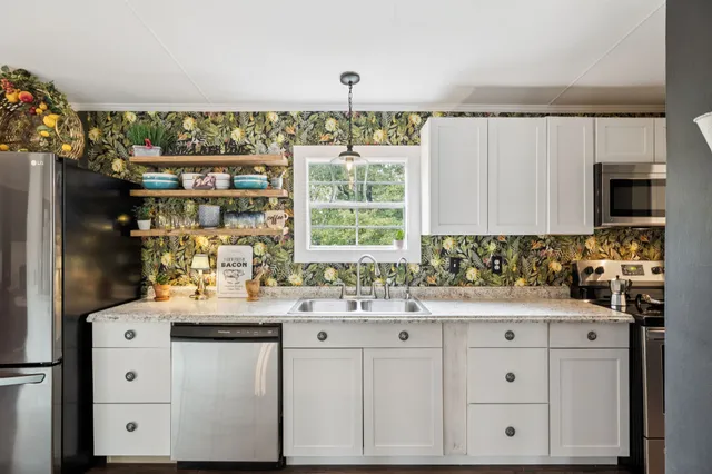 a kitchen with a sink and a refrigerator