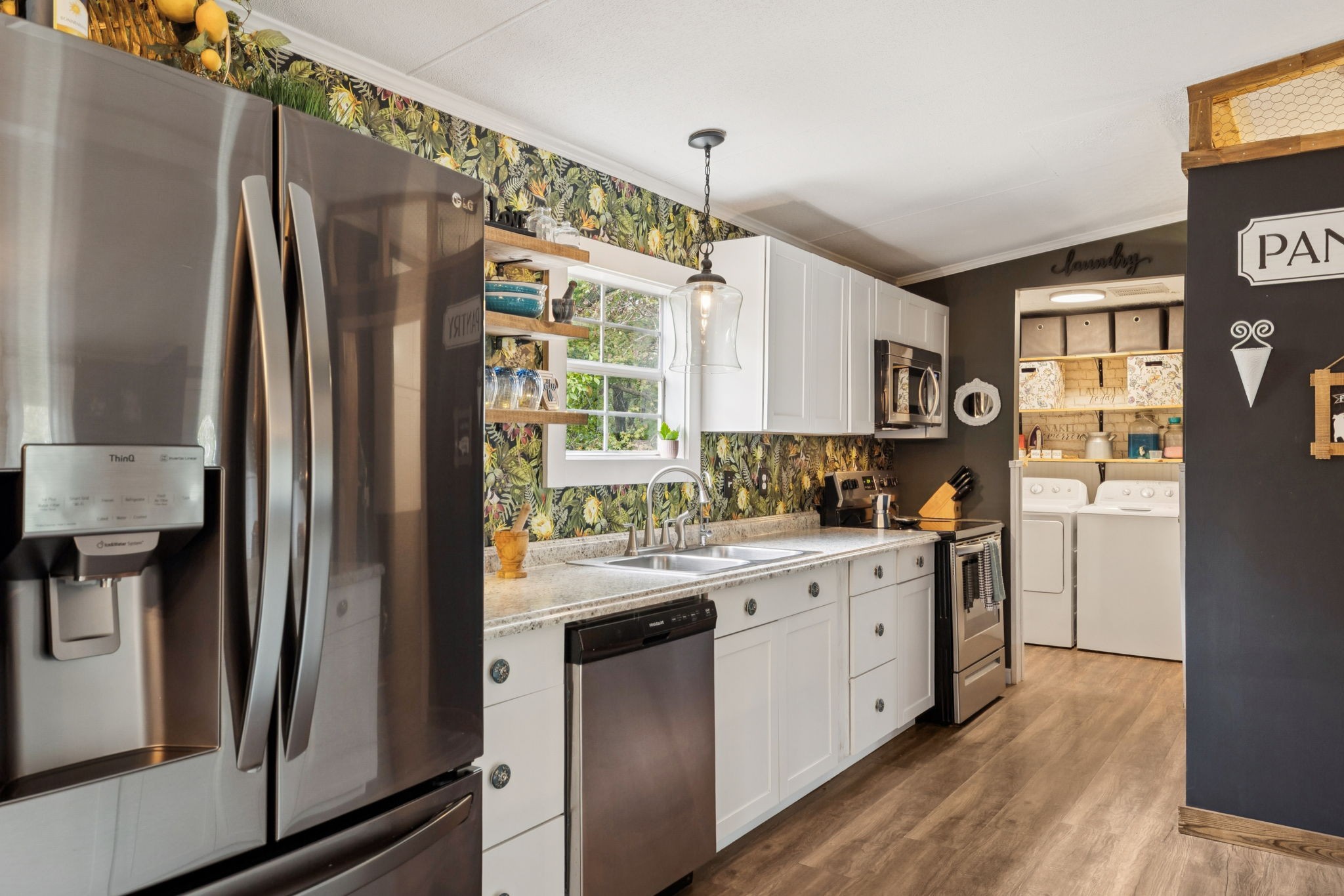 2108 Lance Court Centerville, TN 37033 - Photo 19 of 51 a kitchen with white cabinets and white appliances