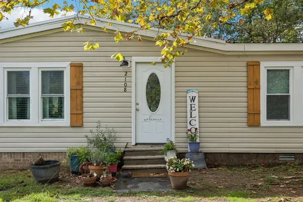 a view of a living room and dining room
