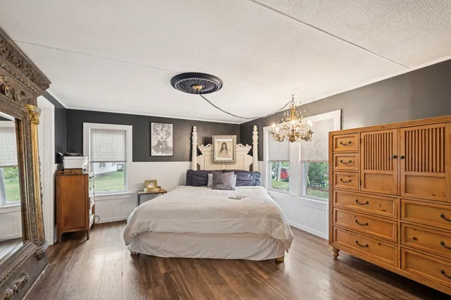 a bathroom with a sink a mirror and shower