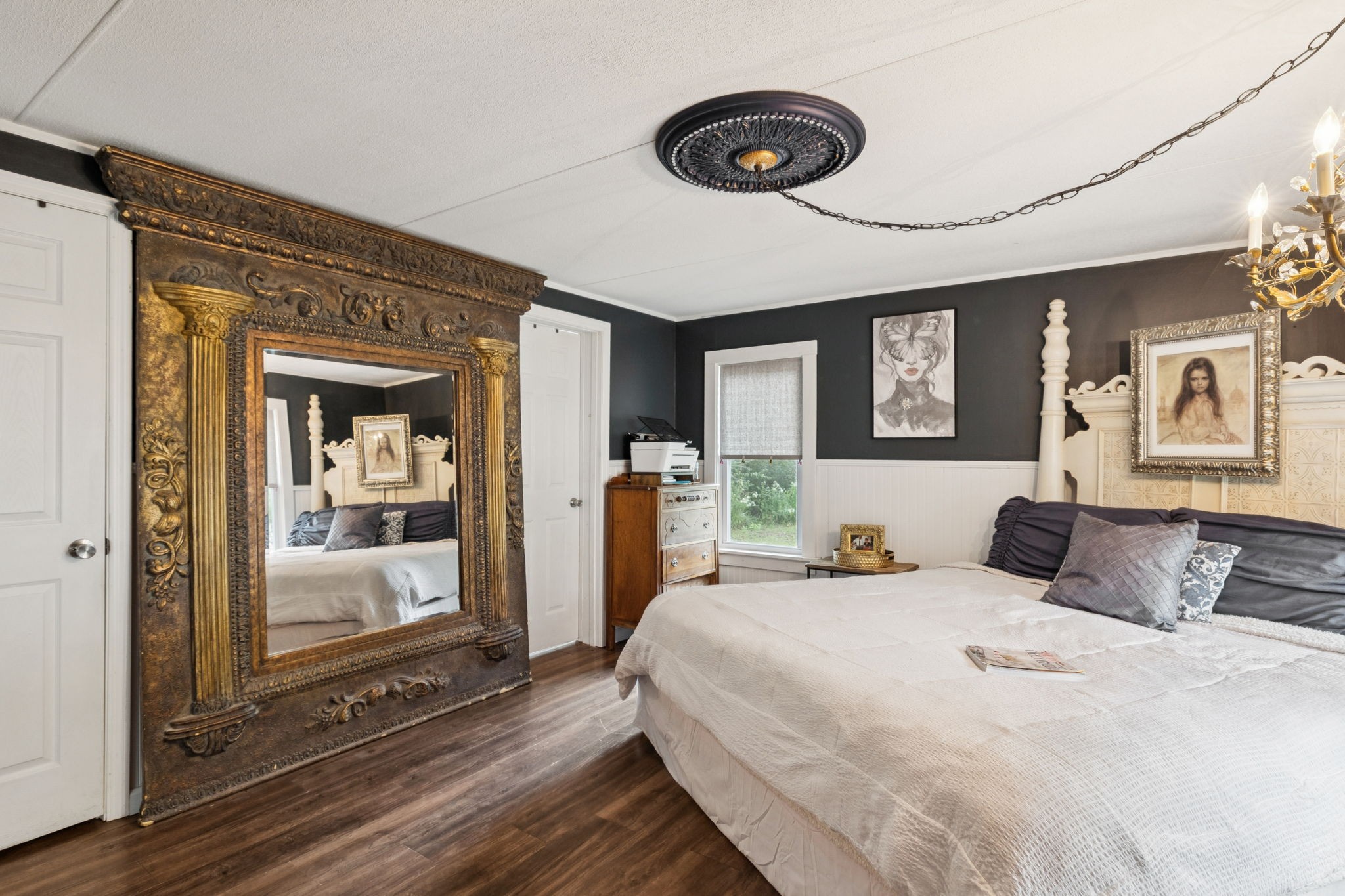 2108 Lance Court Centerville, TN 37033 - Photo 26 of 51 a bedroom with a large bed and a chandelier