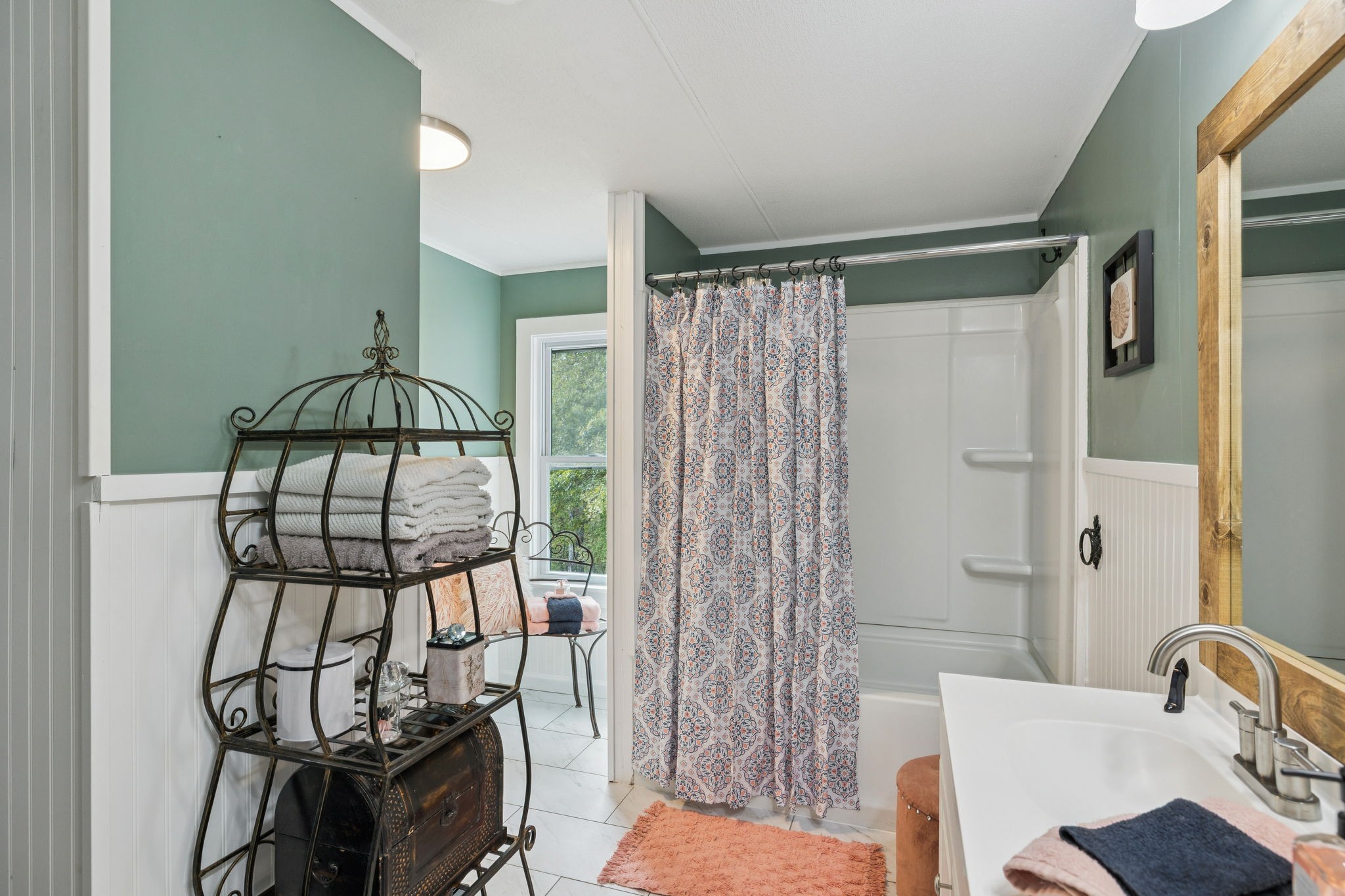2108 Lance Court Centerville, TN 37033 - Photo 34 of 51 a bathroom with a sink a mirror and shower