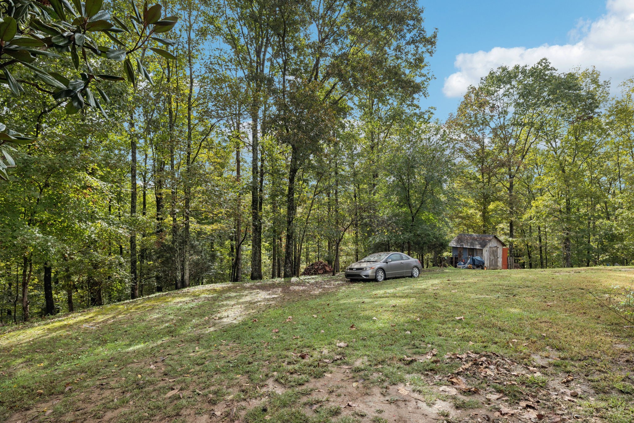 2108 Lance Court Centerville, TN 37033 - Photo 39 of 51 a yellow and red house with lots of trees