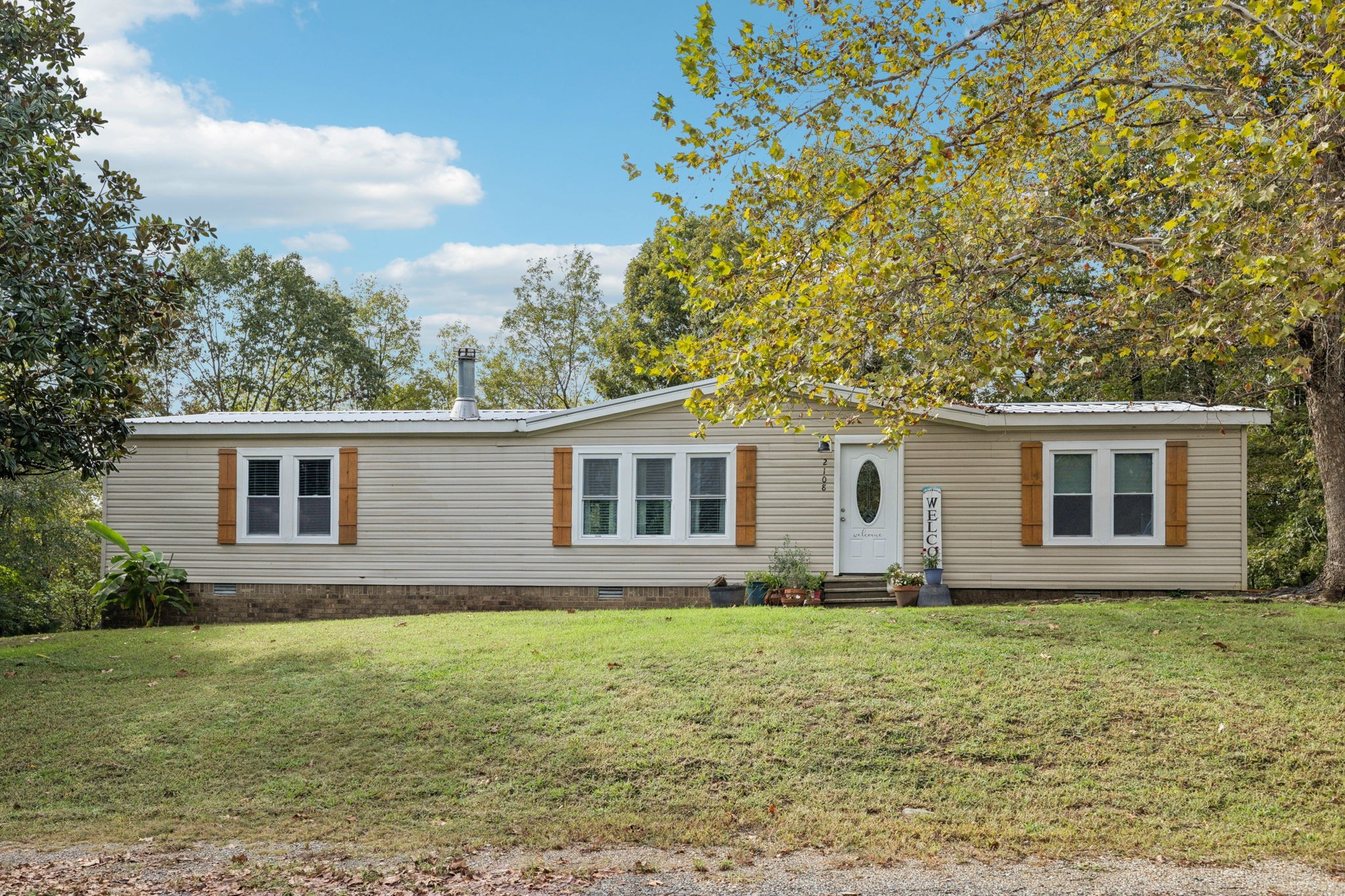 2108 Lance Court Centerville, TN 37033 - Photo 44 of 51 a front view of house with yard and trees in the background