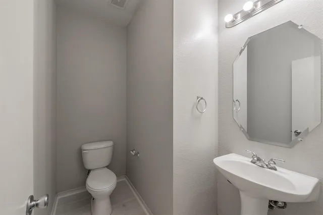 a kitchen with stainless steel appliances granite countertop a sink stove and microwave