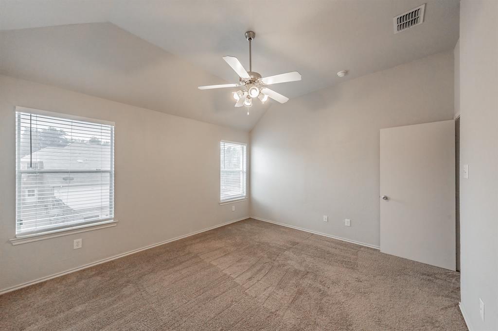5446 Prairie Lane Grand Prairie, TX 75052 - Photo 19 of 39 an empty room with windows and chandelier fan